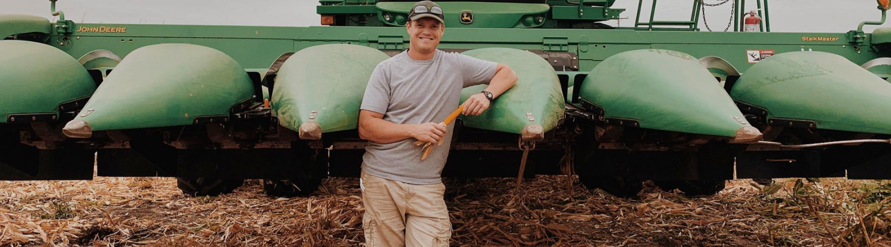 Man in front of combine